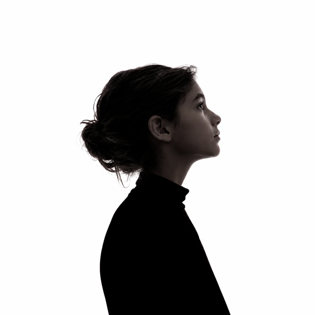 Creative agent in right-facing profile